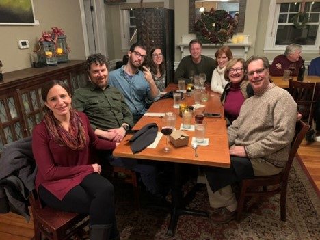 Our holiday dinner in 2019 with our spouses.